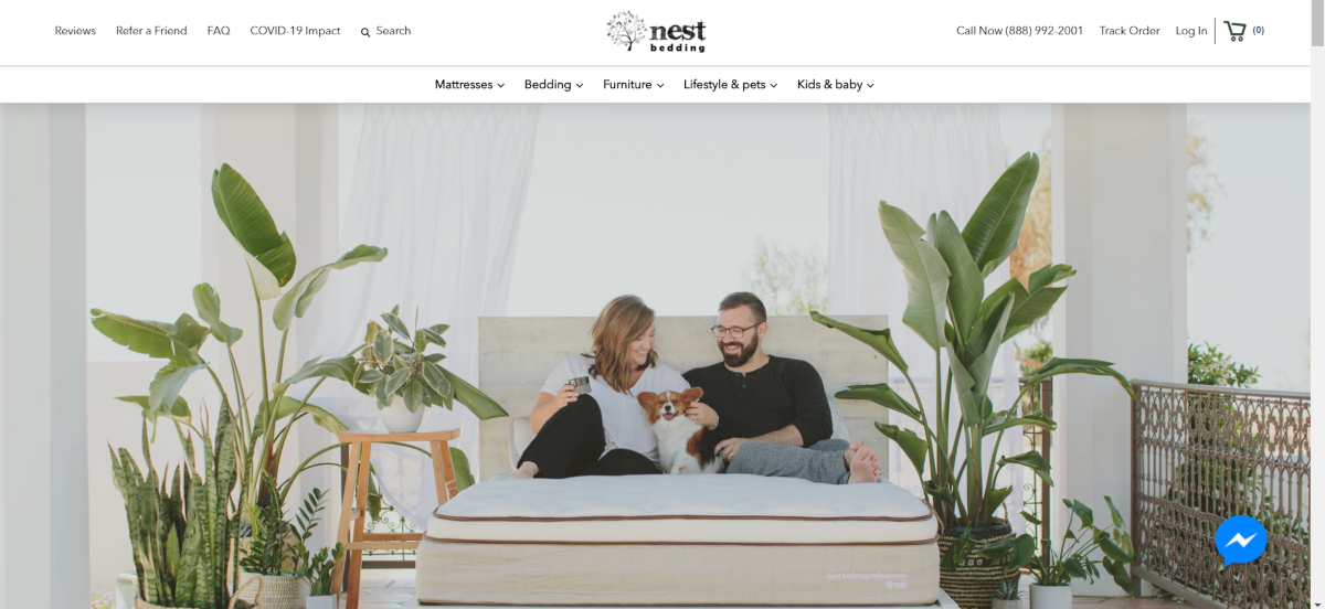 This is a screenshot of the Nest Bedding website showing a photo of a couple and their pet dog relaxing on a branded Nest Bedding mattress.