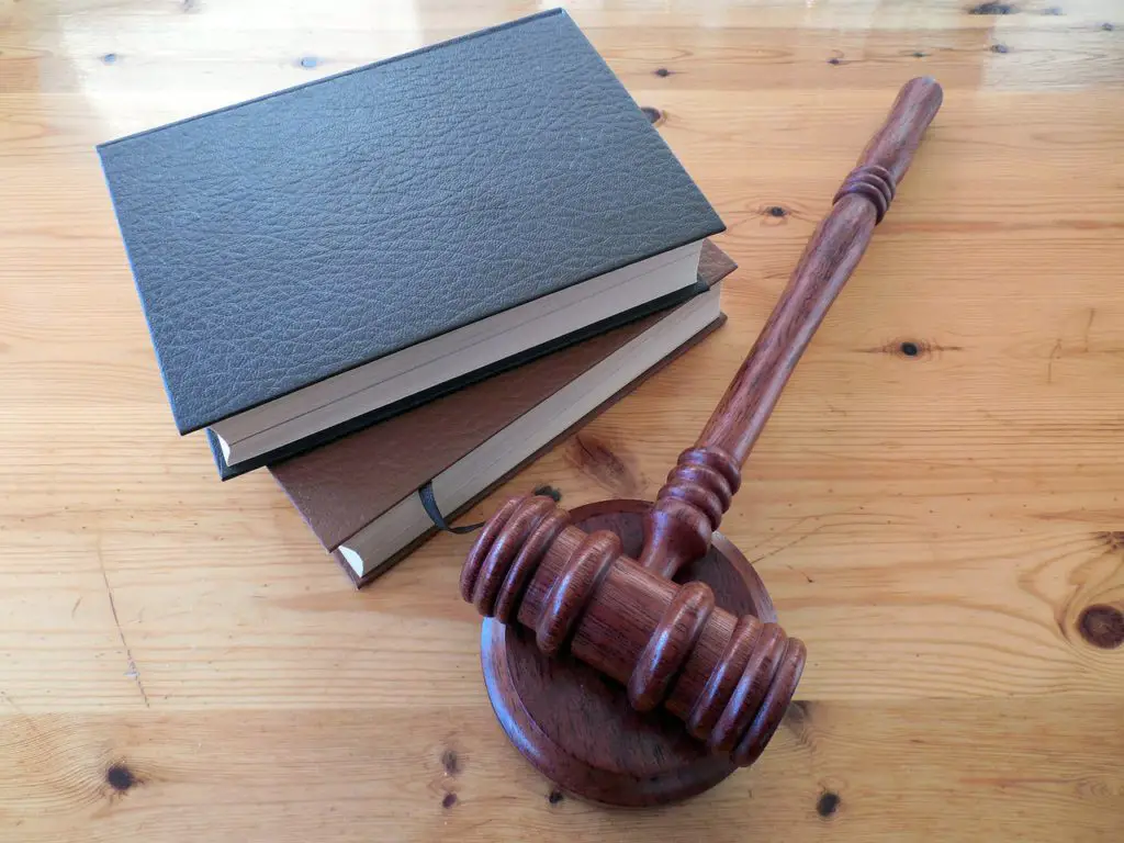 a gavel and two books on a table to represent lawyer affiliate programs